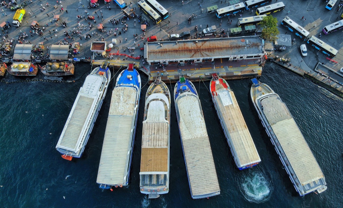 cruise terminal with boats moored alongside a concrete pier