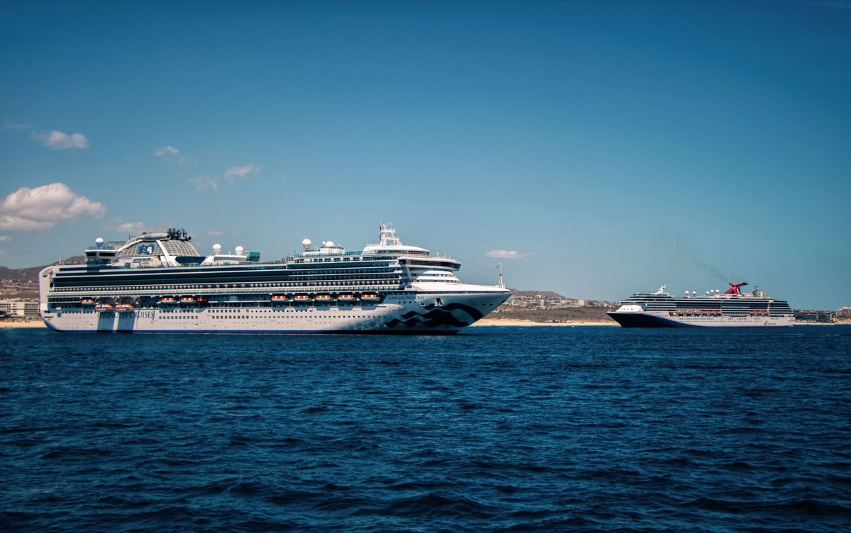 crystal clear water with cruise ships in the distance
