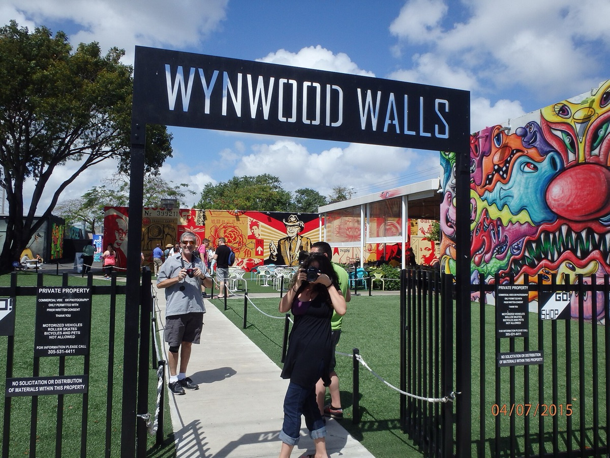 Photograph of a street artist painting a mural in the heart of Wynwood, Miami